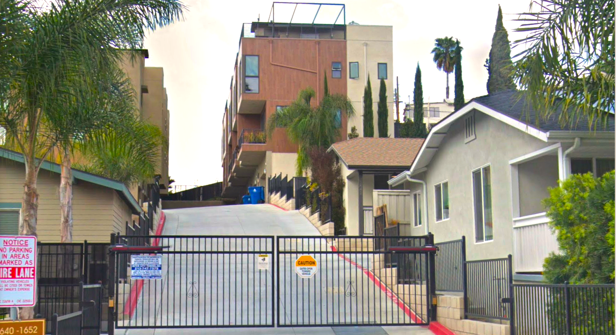 Small lot subdivision in California looms behind a locked gate above the community.